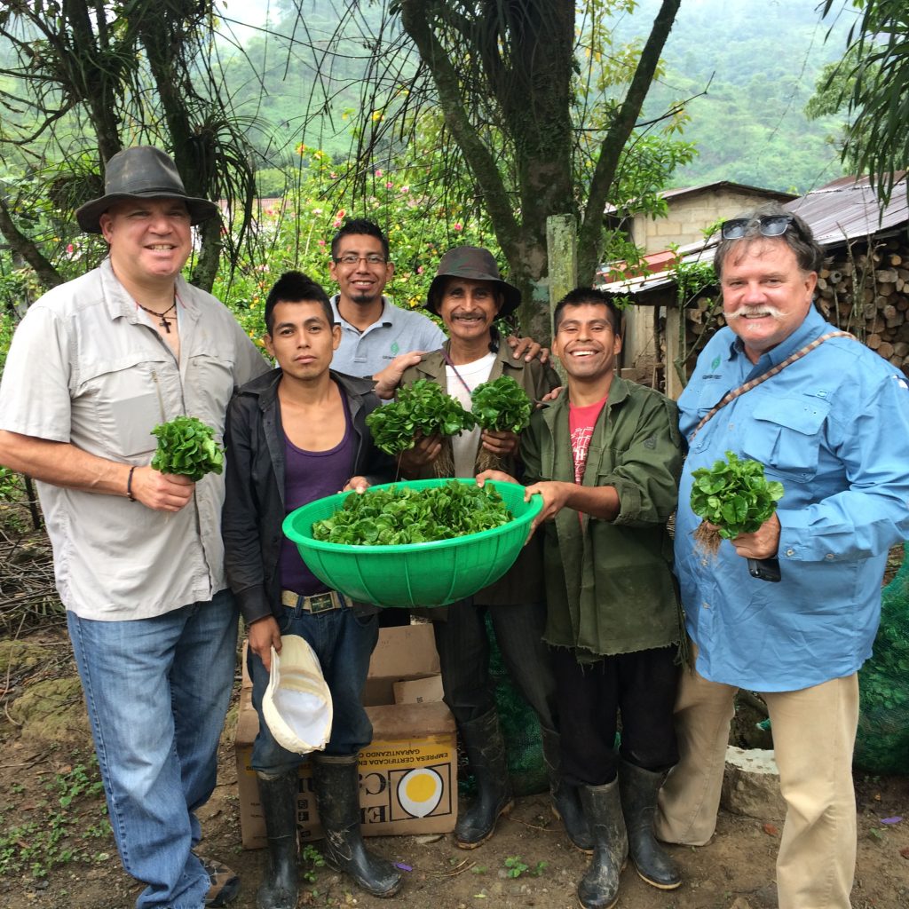 Specialty Coffee Importer Andrew Vournas with Dave Day of Growers First hand out young coffee saplings to coffee farmers in Ixtepec, Oaxaca Mexico