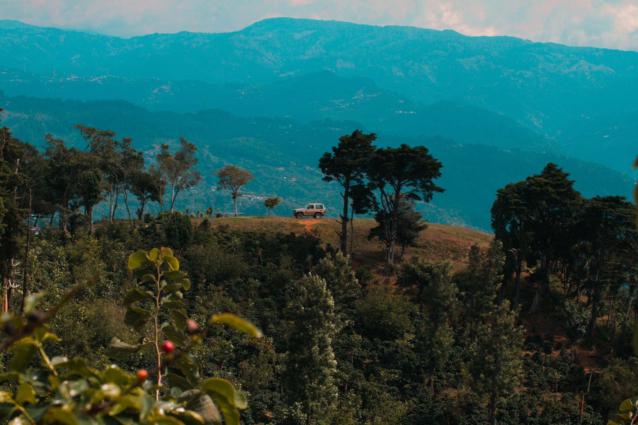 Blue Hills at Dusk Behind a Coffee Farm and SUV in Tarrazu, Costa Rica